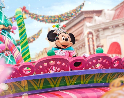 Minnie Mouse on a festive float during the Disneyland Paris Christmas parade.