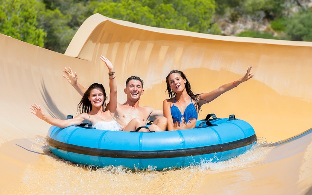 Group enjoying the Grand Canyon water slide at Western Water Park.