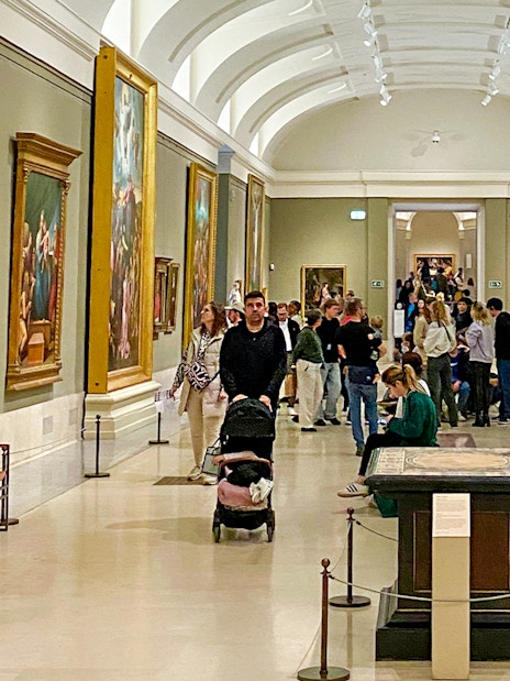 Visitors viewing Goya paintings at the Prado Museum exhibition in Madrid.