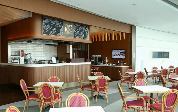 Café 100 dining area at Sky100 Hong Kong with tables and chairs.
