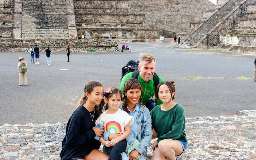 Family posing in front of the Pyramid of the Moon at Teotihuacán during a tour from Mexico City.