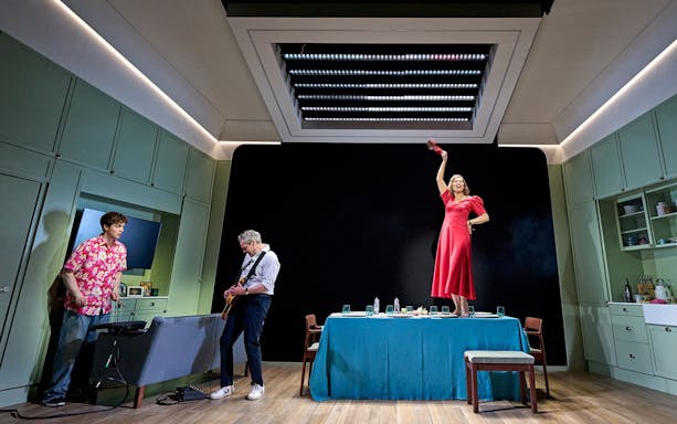 Stage performance of Inter Alia show on Broadway with actors in a kitchen setting.