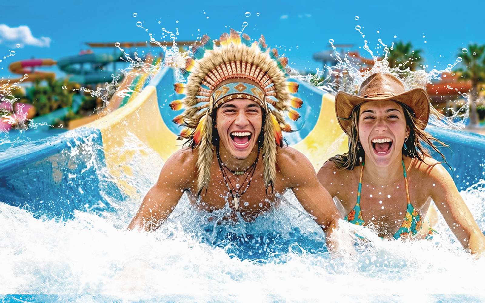 Tourists enjoying a water slide at Western Water Park.