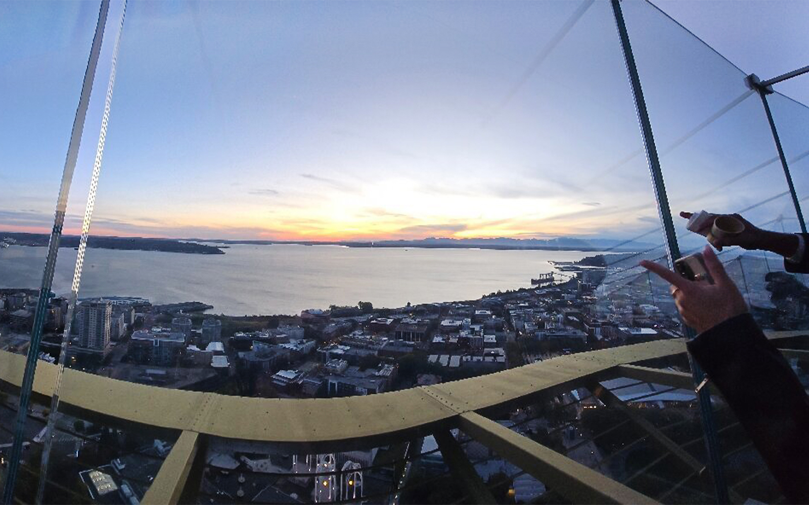 Seattle skyline and waterfront view from the Space Needle at sunset.
