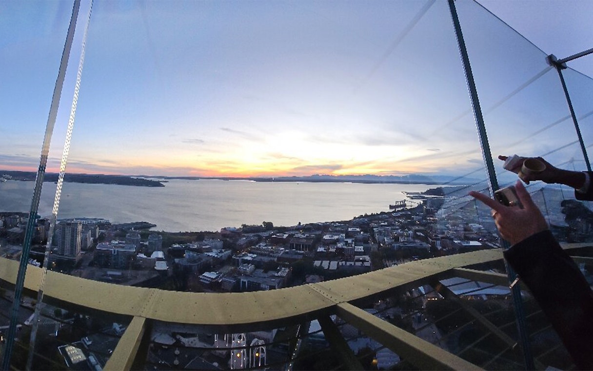 Seattle skyline and waterfront view from the Space Needle at sunset.