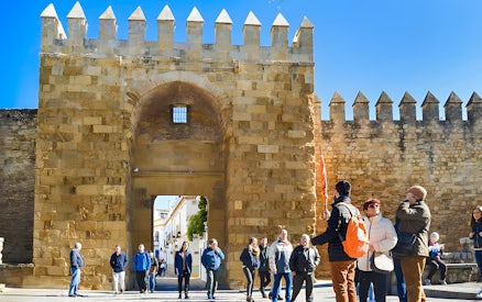 Tour group at the entrance of the Alcázar in Córdoba's Jewish Quarter.