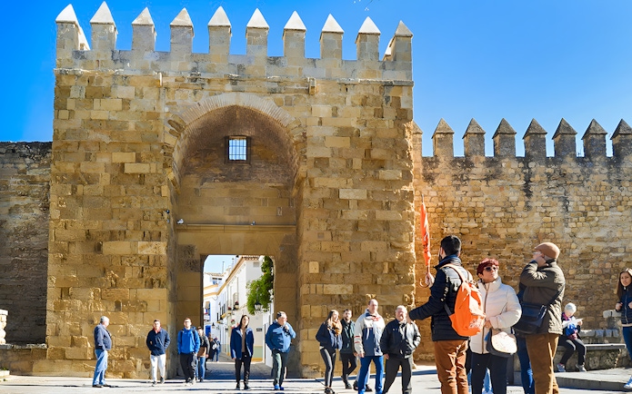 Tour group at the entrance of the Alcázar in Córdoba's Jewish Quarter.
