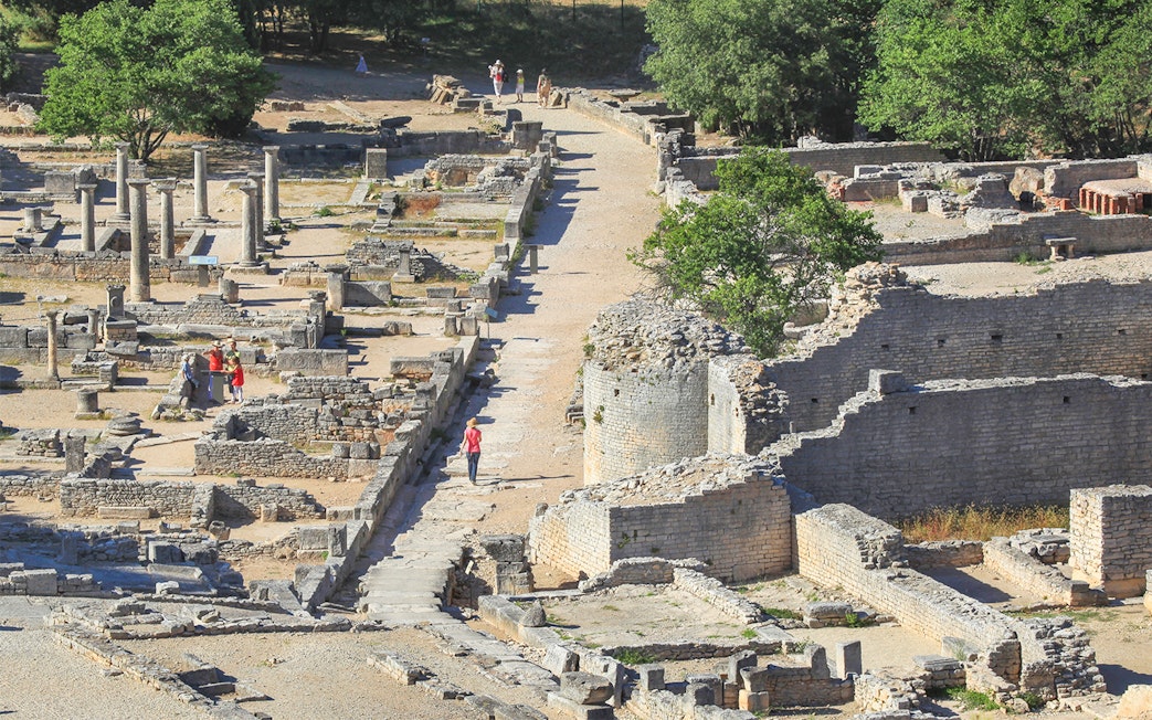 Ancient ruins and columns at Glanum Archaeological Site in Saint-Rémy-de-Provence, France.