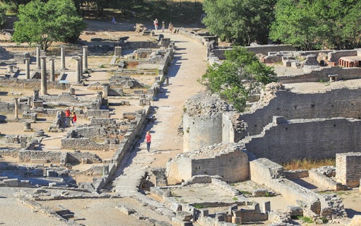 Ancient ruins and columns at Glanum Archaeological Site in Saint-Rémy-de-Provence, France.