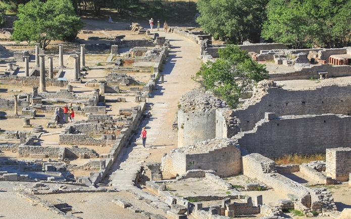 Ancient ruins and columns at Glanum Archaeological Site in Saint-Rémy-de-Provence, France.