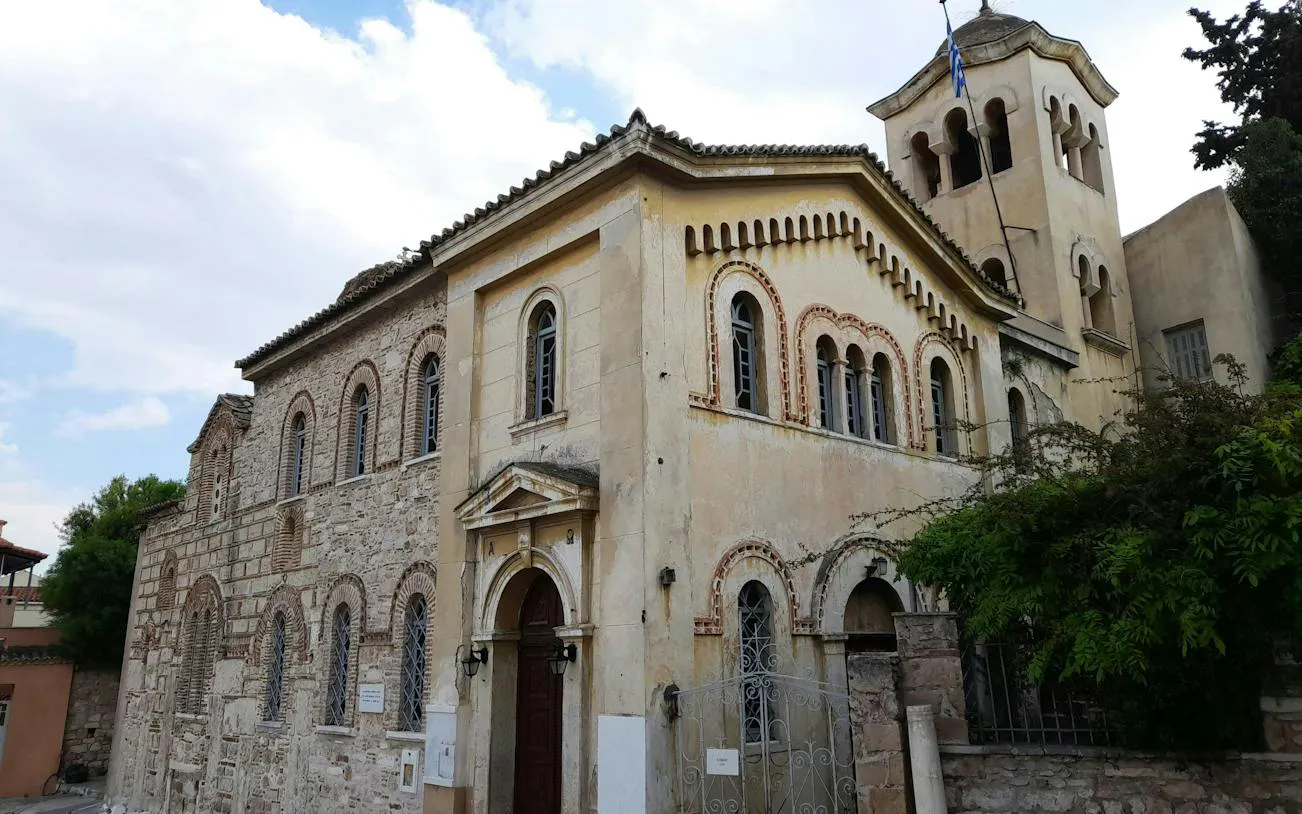 Historic church facade in Plaka, Athens, part of the self-guided city exploration game.