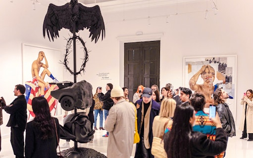 Visitors at Moco Museum Barcelona exhibit viewing contemporary art installations.