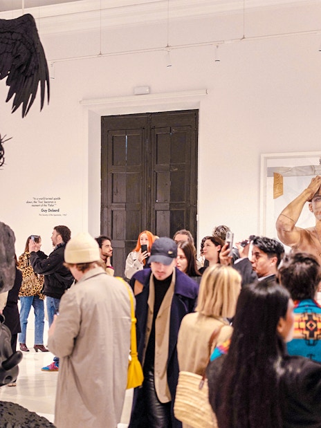 Visitors at Moco Museum Barcelona exhibit viewing contemporary art installations.