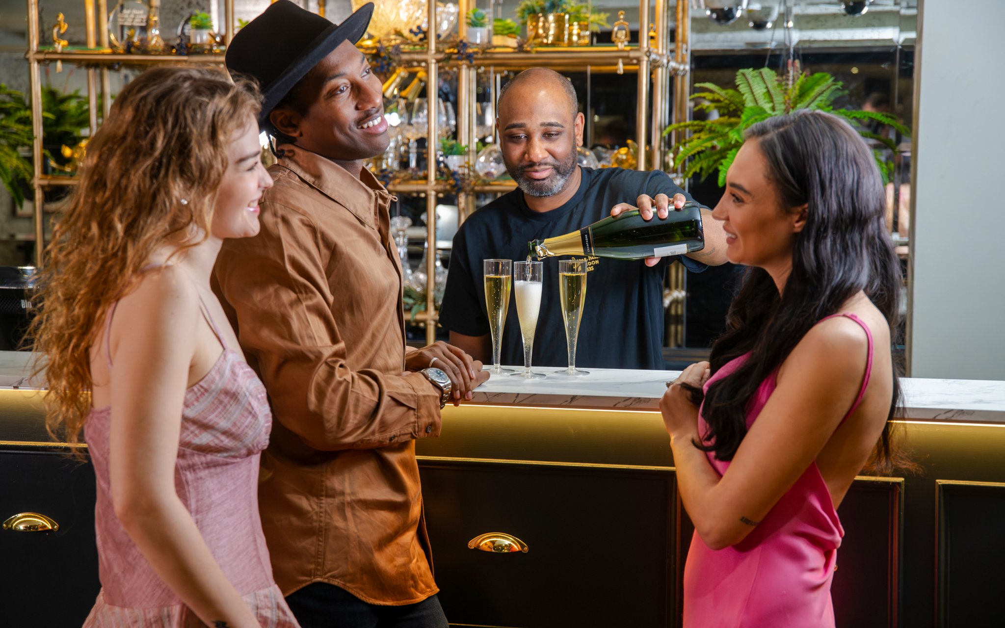 Guests enjoying The Champagne Bar Experience at Madame Tussauds London.