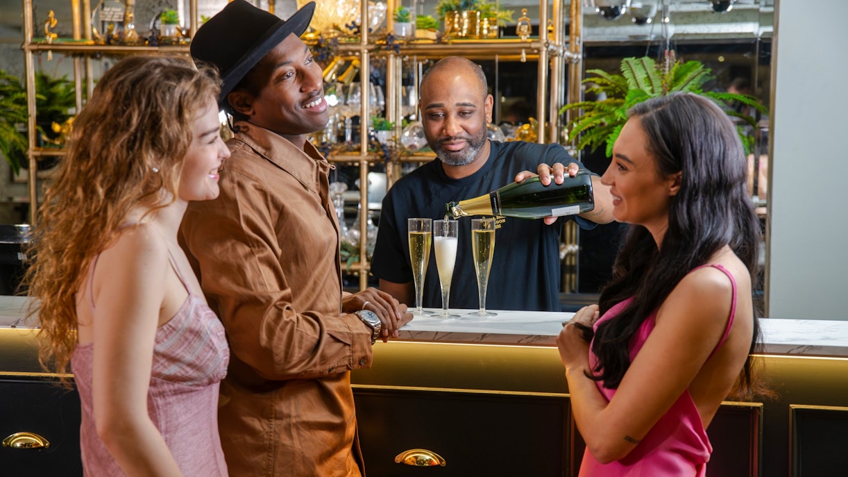 Guests enjoying The Champagne Bar Experience at Madame Tussauds London.