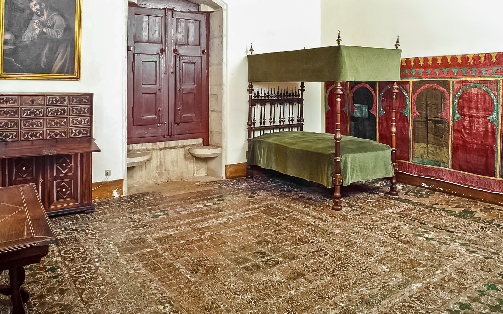 Chamber of D Afonso VI with canopy bed and ornate decor in Sintra National Palace.