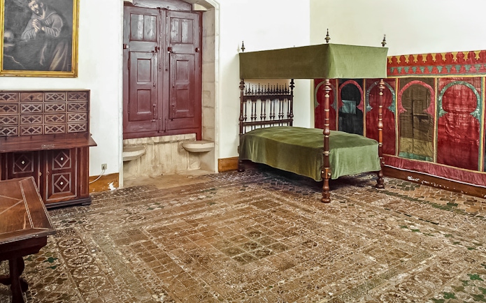 Chamber of D Afonso VI with canopy bed and ornate decor in Sintra National Palace.