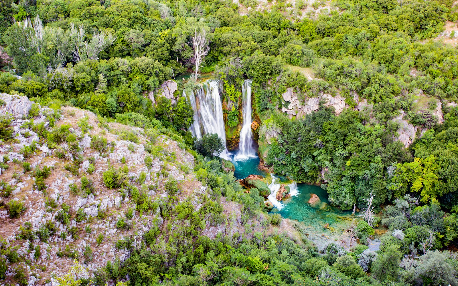 Manojlovac waterfall cascading over rocks at Krka National Park, Croatia.