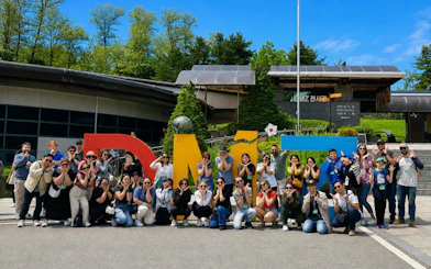 Group posing at DMZ Pavilion entrance during Half Day DMZ Tour with JSA Photo Zone.