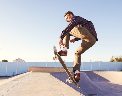 Skateboarder performing a trick at Urban Week Paris La Défense skate park.