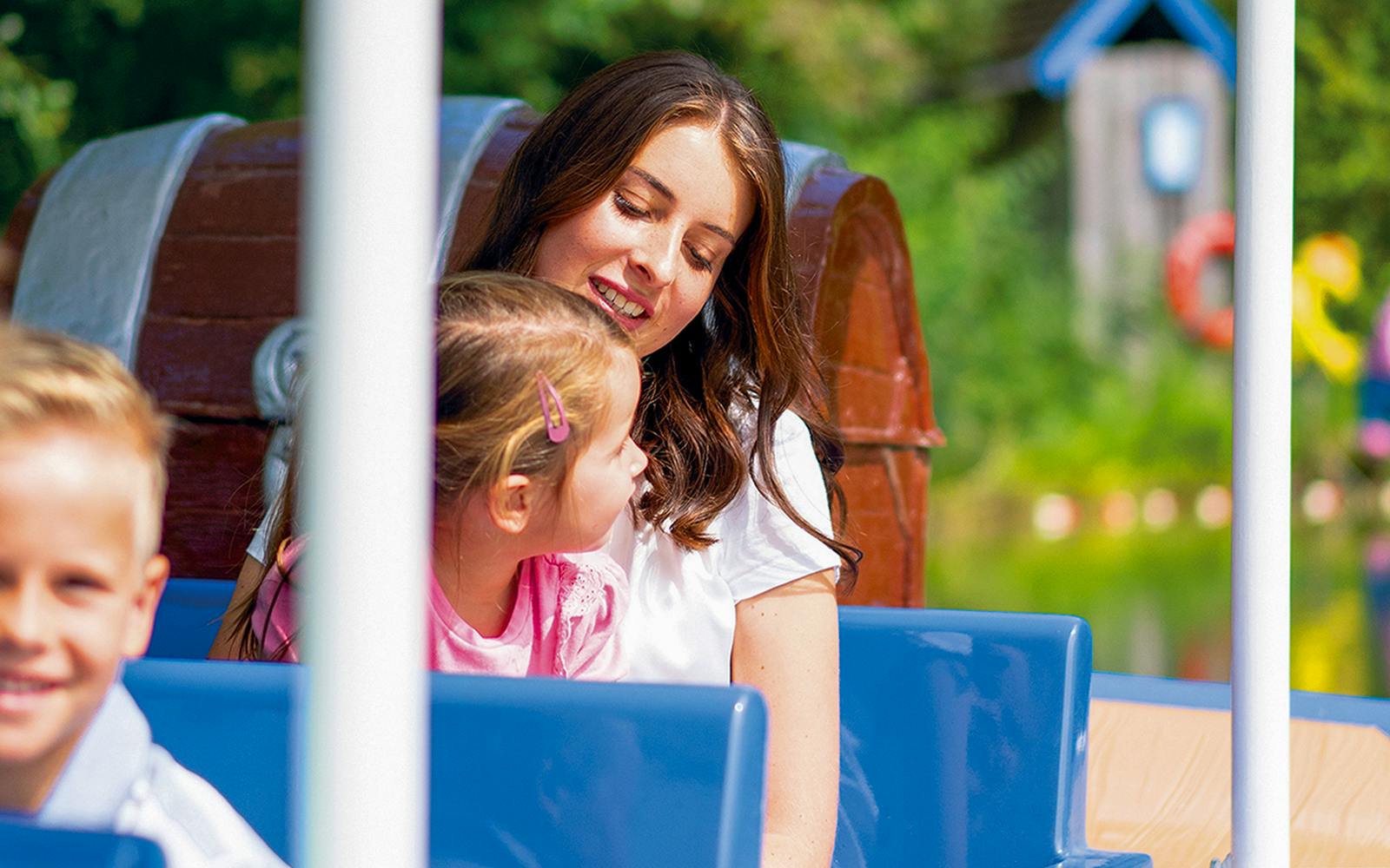 Visitors enjoying a boat ride at Ravensburger Spieleland.