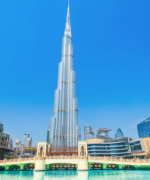 Burj Khalifa and surrounding Dubai skyline on a sunny day during a full day tour.