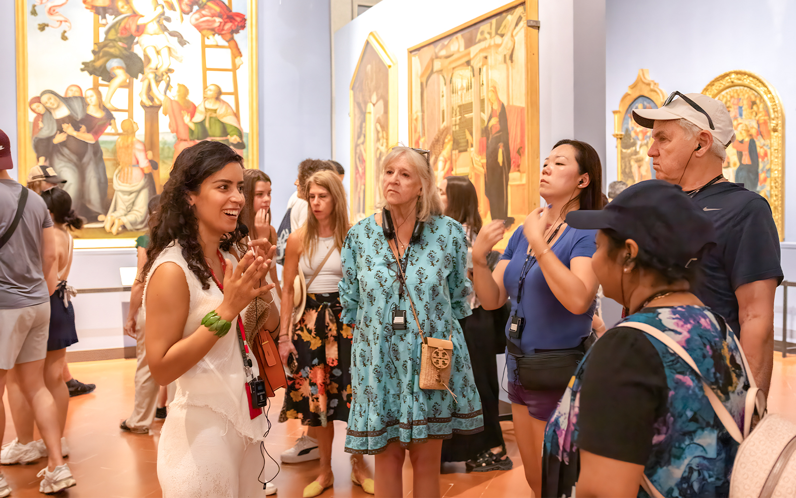 Tour group with guide at Accademia Gallery, Florence, viewing Michelangelo's David statue.