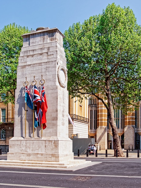 Cenotaph war memorial with flags on Whitehall, London.
