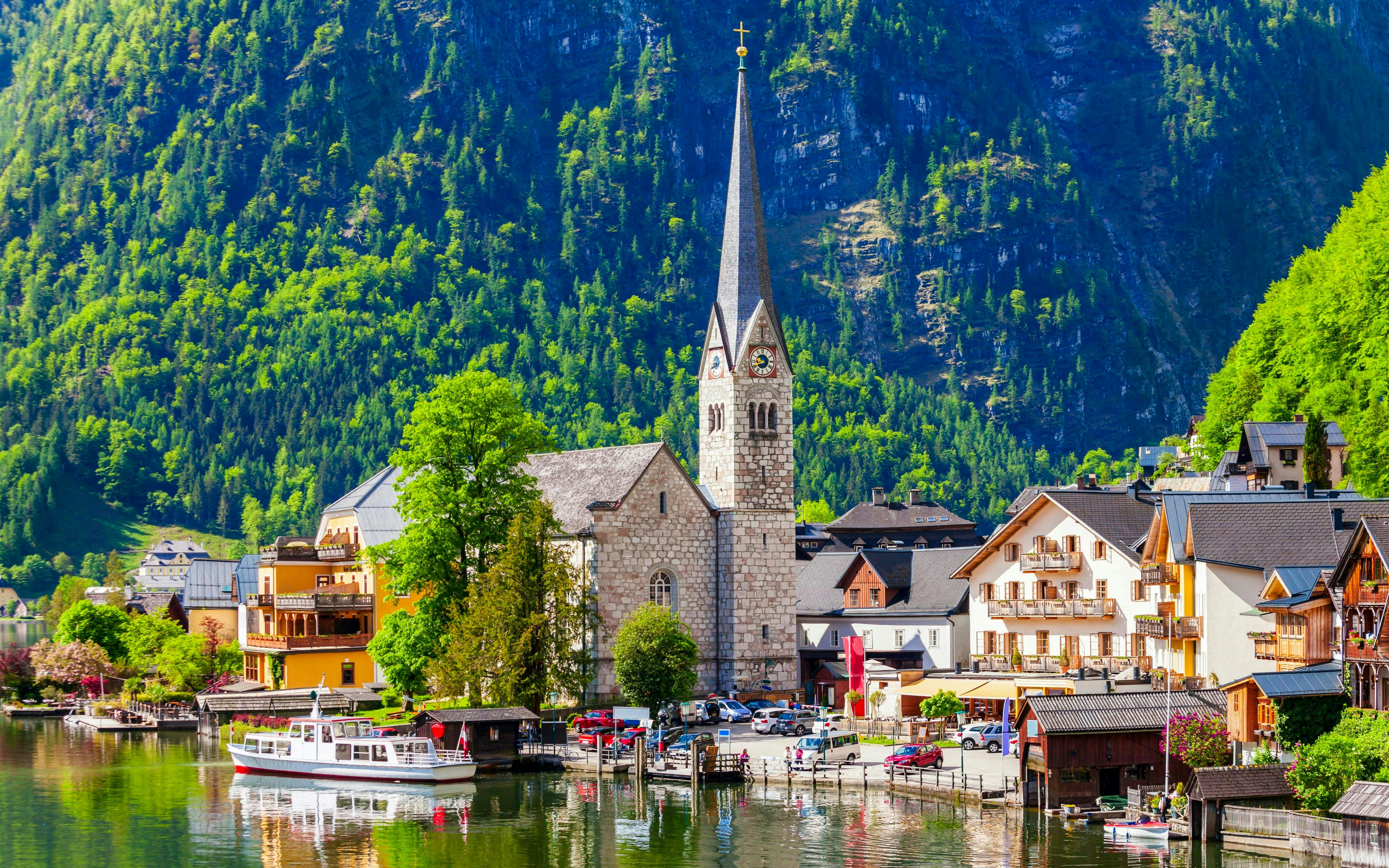 Lutheran Church in Hallstatt with mountains and lake in the background, Vienna tour.