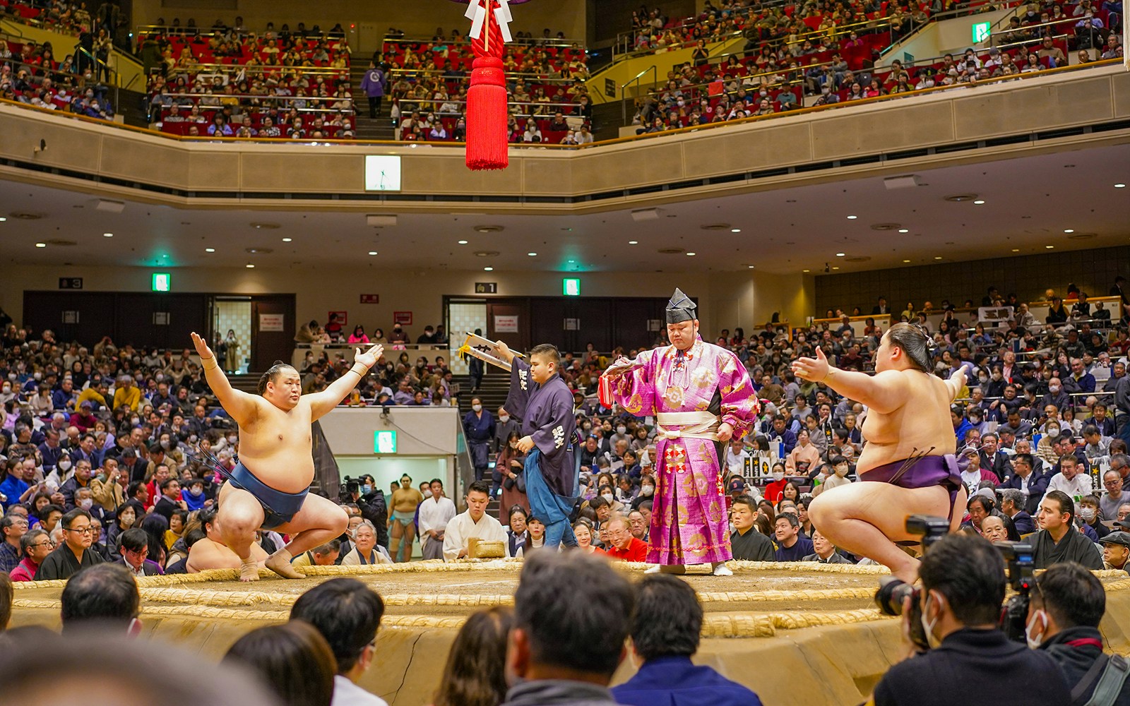 Sumo wrestlers face off at Tokyo Sumo Wrestling Tournament in Ryogoku arena.
