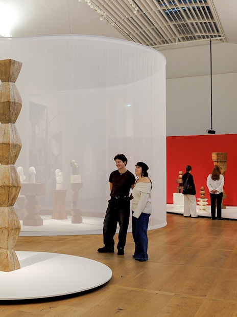 Guests viewing sculptures inside the Hart Museum of Amsterdam.