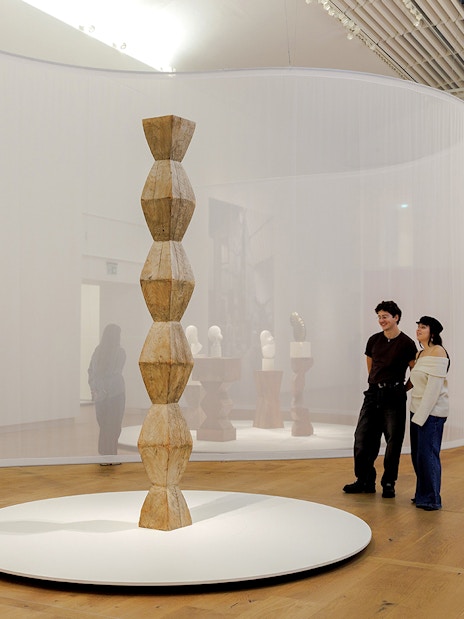 Guests viewing sculptures inside the Hart Museum of Amsterdam.