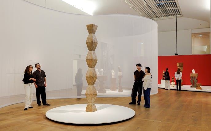 Guests viewing sculptures inside the Hart Museum of Amsterdam.
