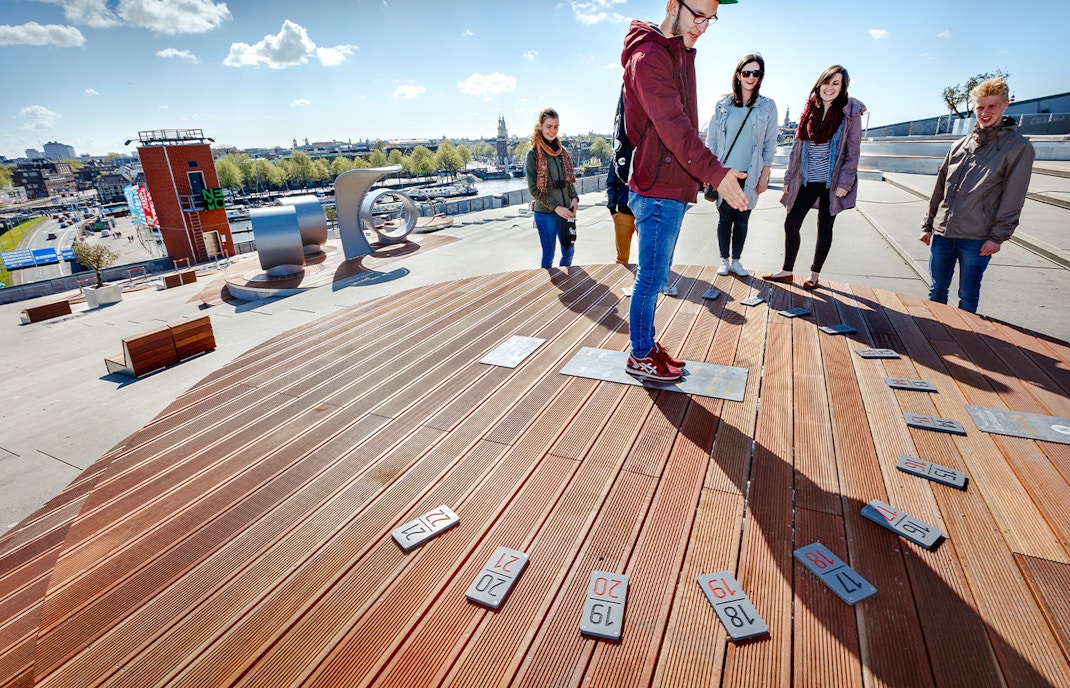 Visitors exploring rooftop exhibit at NEMO Science Museum in Amsterdam.