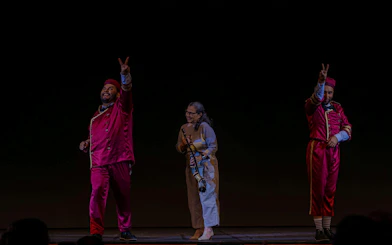 Performers in vibrant costumes on stage at Roxy Dinner Show, Rio de Janeiro.