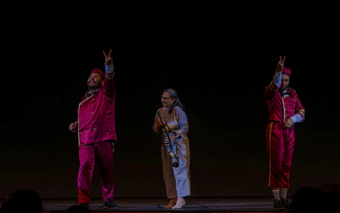 Performers in vibrant costumes on stage at Roxy Dinner Show, Rio de Janeiro.