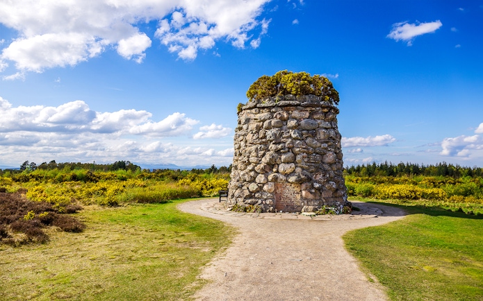 Culloden Battlefield cairn with scenic view of Inverness and the Highlands, tour from Edinburgh.