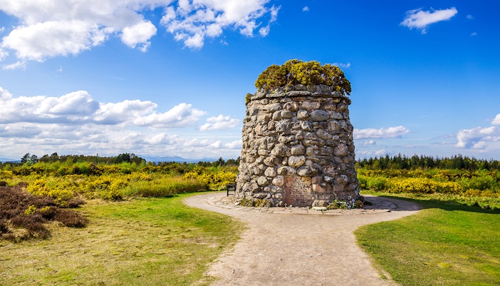 Culloden Battlefield cairn with scenic view of Inverness and the Highlands, tour from Edinburgh.