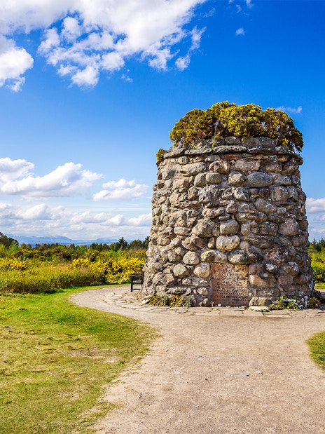 Culloden Battlefield cairn with scenic view of Inverness and the Highlands, tour from Edinburgh.