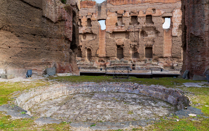 Calidarium ruins at Baths of Caracalla, Rome, showcasing ancient Roman architecture.