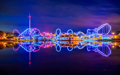 Roller coaster illuminated at night during Halloween at Heide Park, Germany.