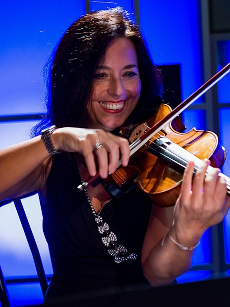 Violinist performing at Great Opera Arias Concert in Rome.