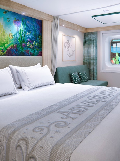 Deluxe Inside Stateroom with reef-themed decor on Disney Adventure Cruise.