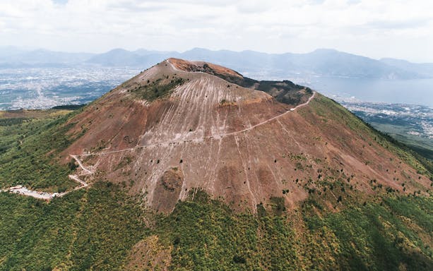 Aerial view of Mount Vesuvius with surrounding landscape in Italy.