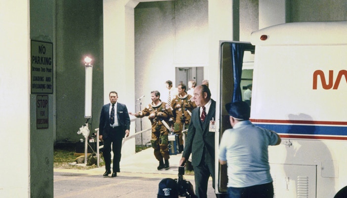 Columbia STS-1 crew walking to Astrovan at Kennedy Space Center.