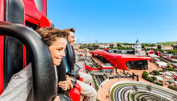 Ferrari Land aerial view from ride, showcasing roller coasters and attractions in PortAventura, Spain.