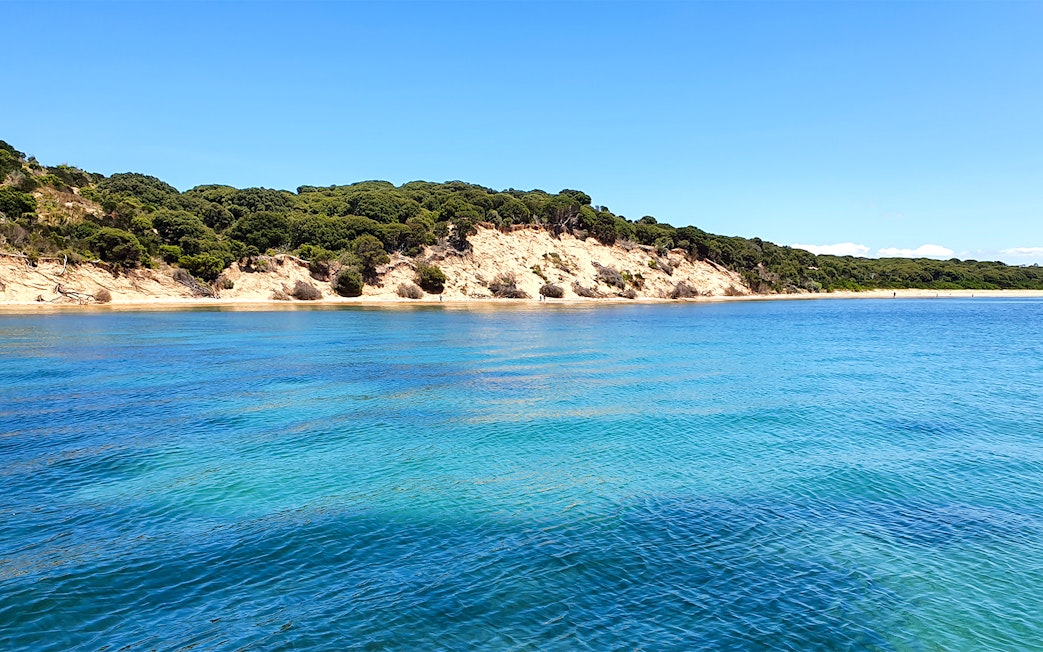 Cape Woolamai coastline with clear blue water, Phillip Island, Australia.