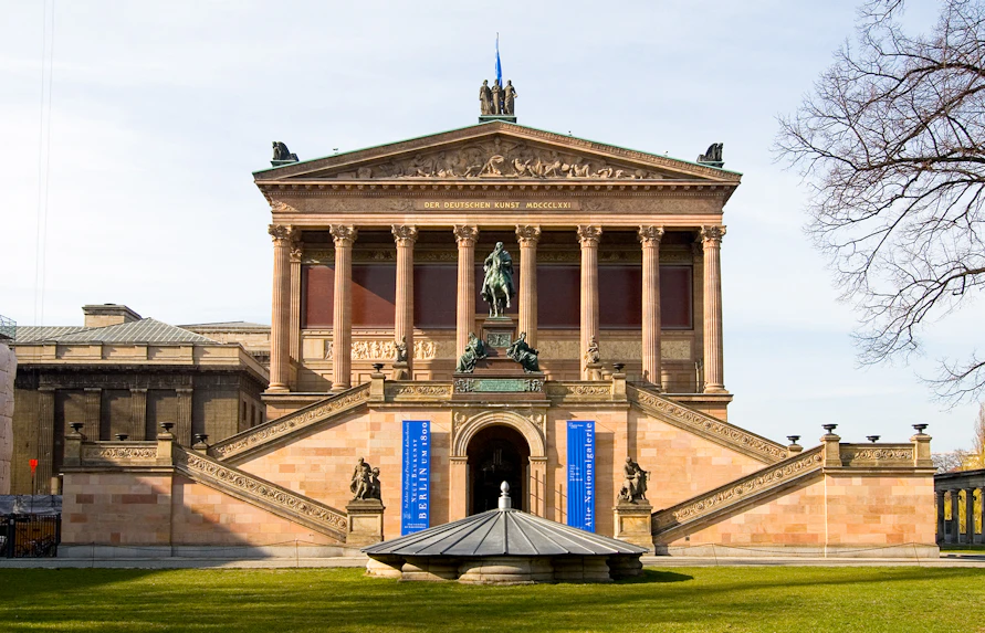 Alte Nationalgalerie facade with steps and statue, Berlin.