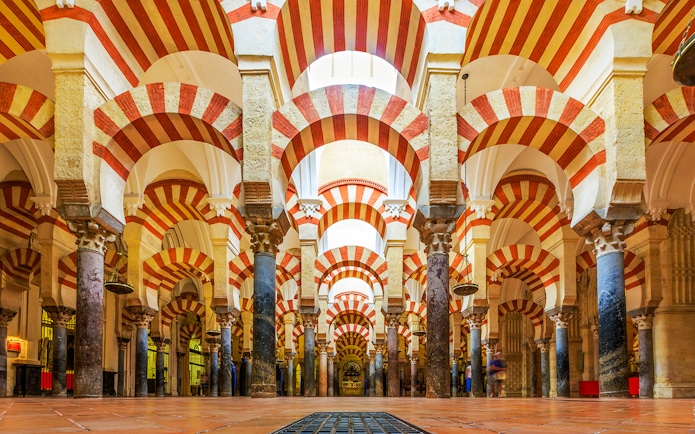 Cordoba Mosque-Cathedral prayer hall with red and white arches.