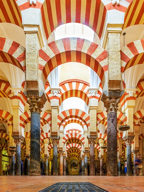 Cordoba Mosque-Cathedral prayer hall with red and white arches.